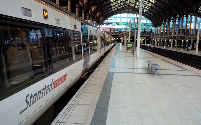 Stansted Express train at a London station platform.