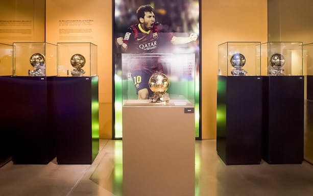 Trophies displayed at FC Barcelona Camp Nou museum during a guided tour.