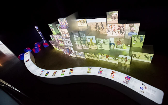 Interactive exhibit at FC Barcelona Camp Nou showcasing football history and culture.