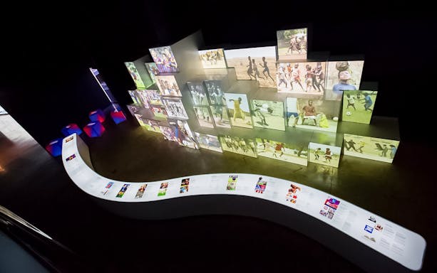 Interactive exhibit at FC Barcelona Camp Nou showcasing football history and culture.