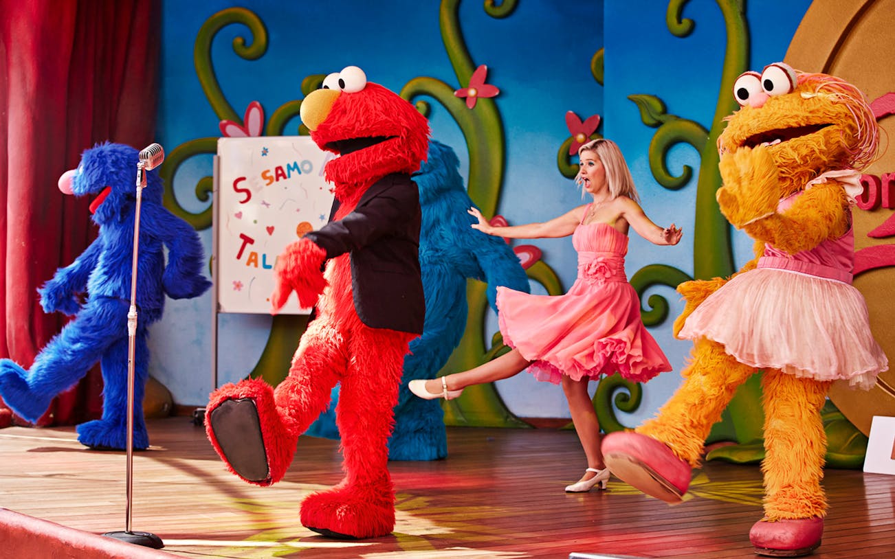 Sesame Street characters performing on stage at PortAventura World.