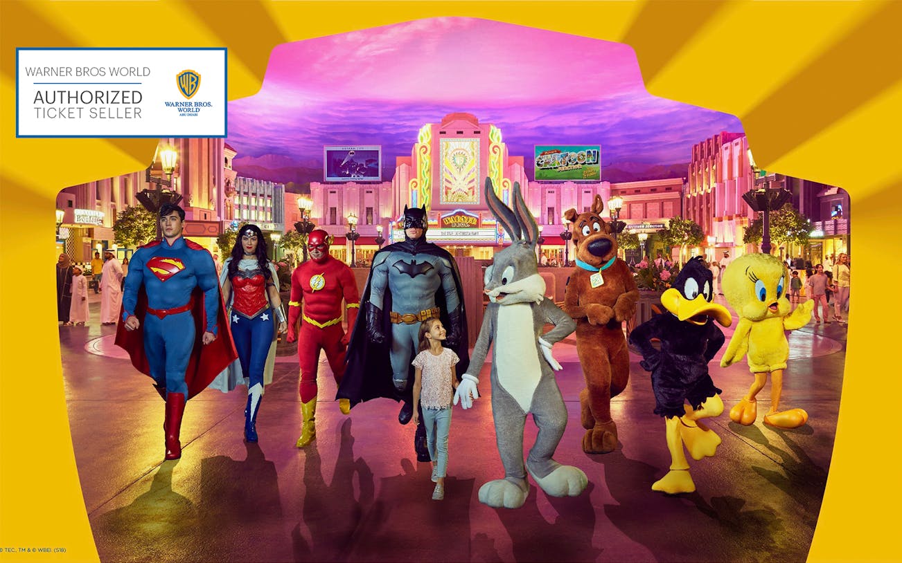 Warner Bros. World Abu Dhabi characters with child in theme park setting.