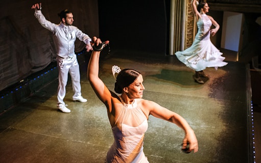 Flamenco dancers performing on stage during a show.