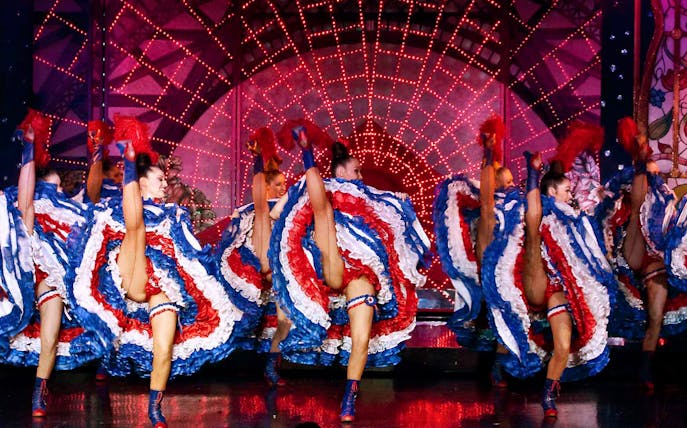 Dancers performing can-can at Moulin Rouge, Paris.