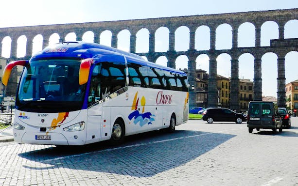 Tour bus near ancient aqueduct in Toledo, Spain, part of the 3 Cultures guided tour.
