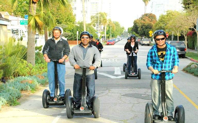 Group riding Segways on a street in Santa Monica, California.