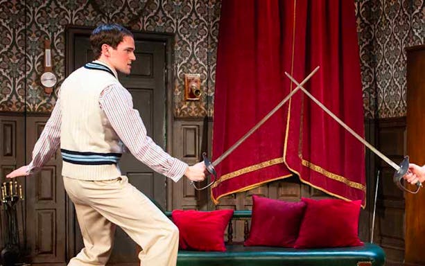 Actor in a sword fight scene from The Play That Goes Wrong on Broadway.