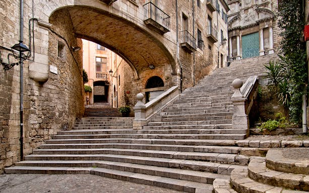 Stone steps and archway in Girona, Spain, featured in Game of Thrones.