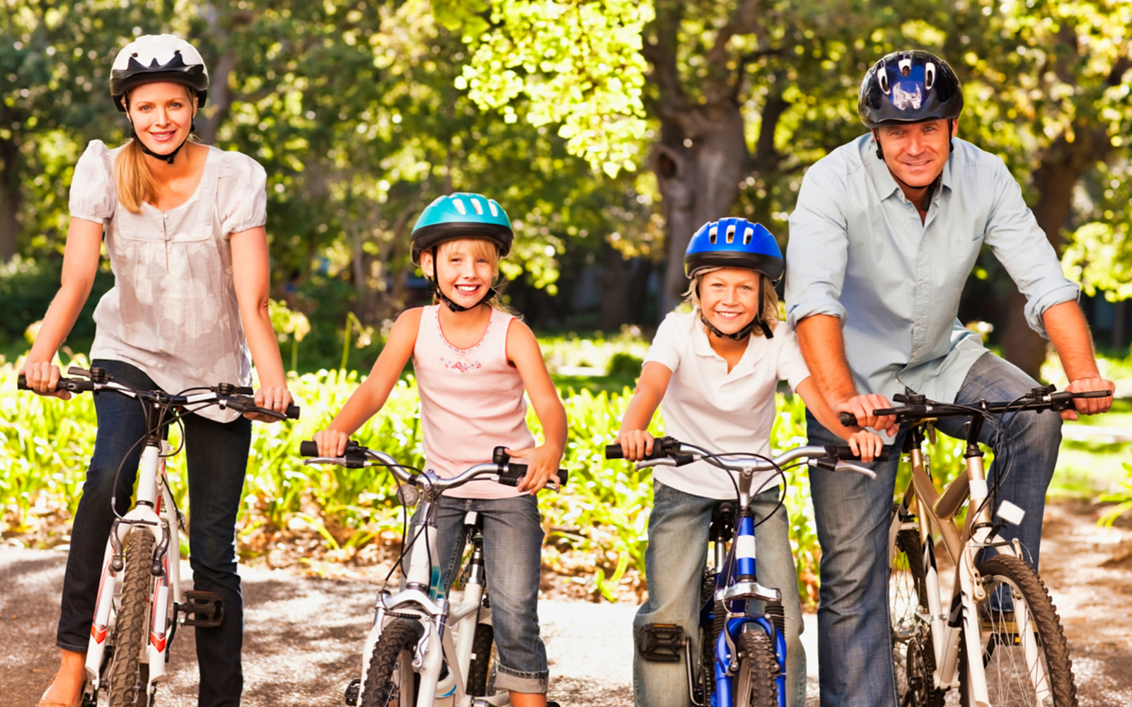 Family biking in Central Park, New York, part of the New York Explorer Pass attractions.