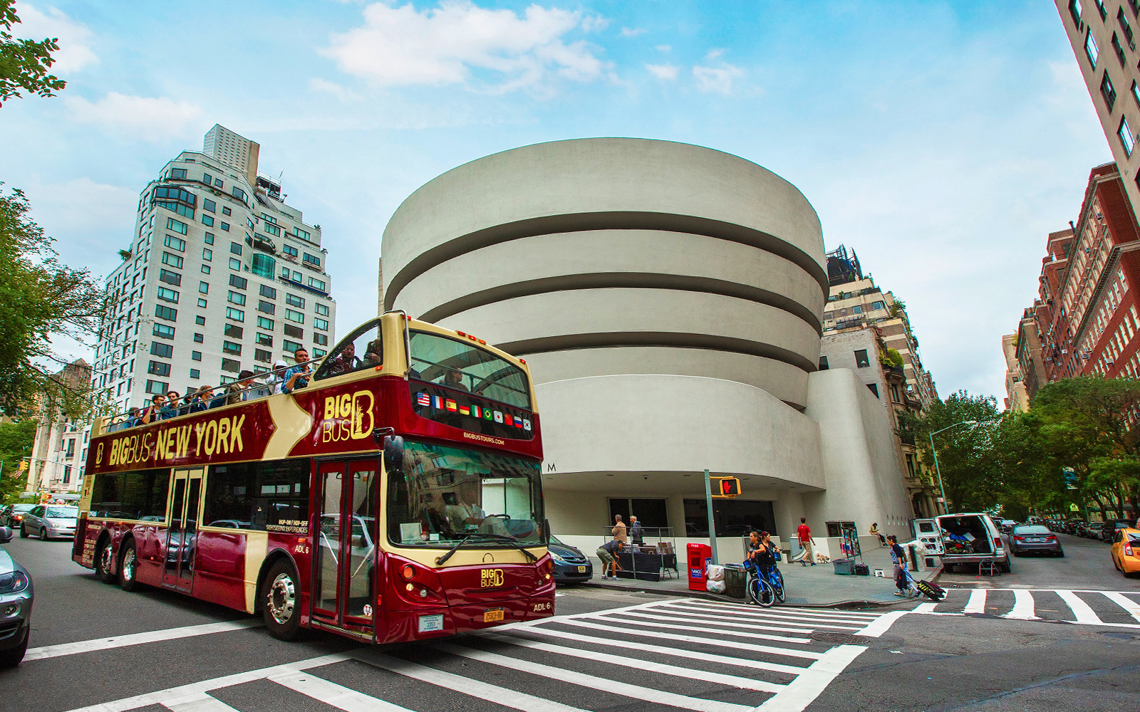 Open-top tour bus in front of the Guggenheim Museum, New York City.