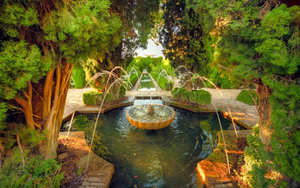 Fountain and gardens in the Generalife, Alhambra, Granada, Spain.