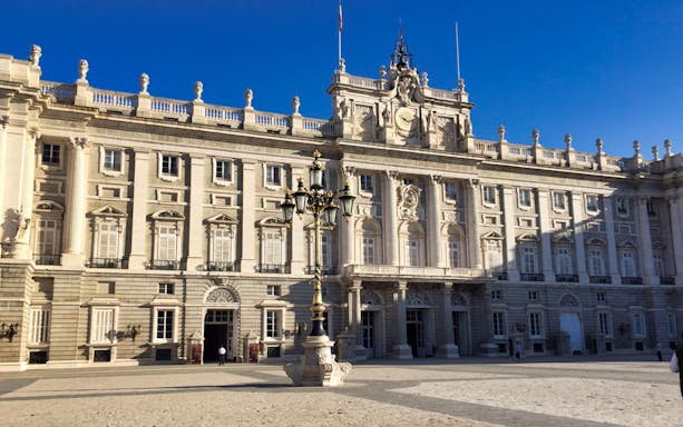 Royal Palace facade in Madrid on a sunny day.