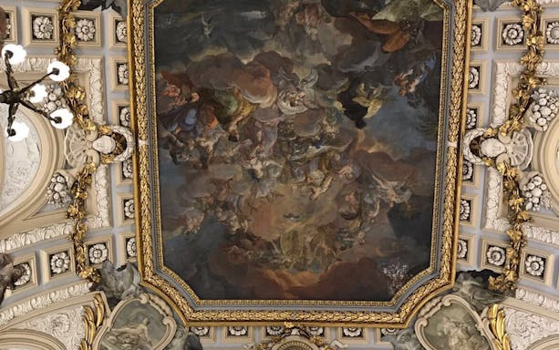 Ceiling fresco in Madrid's Royal Palace during guided tour.