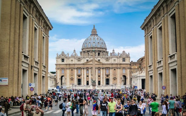 Crowd outside St. Peter’s Basilica, Vatican City, during guided tour.