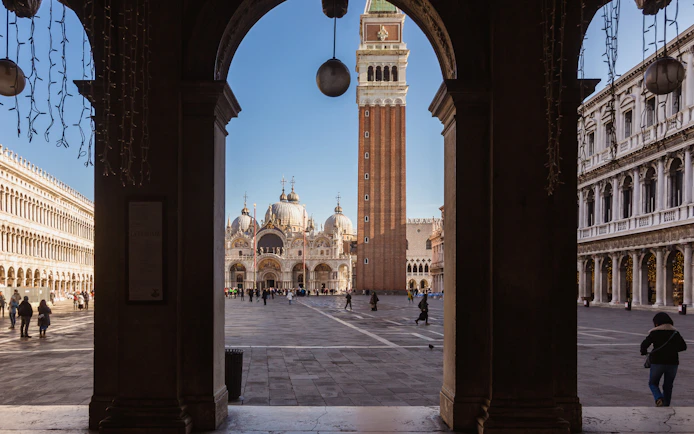 St. Mark's Basilica and Campanile viewed from an archway in Venice.