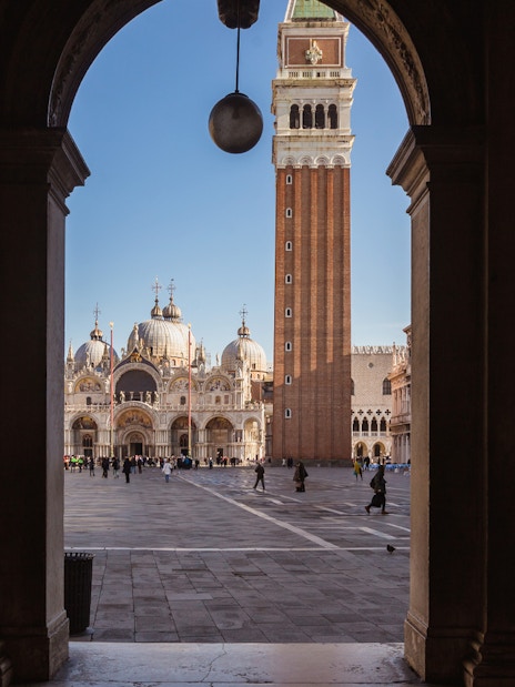 St. Mark's Basilica and Campanile viewed from an archway in Venice.