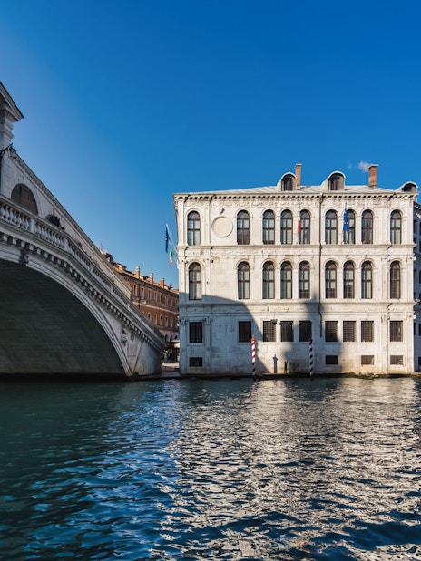 Rialto Bridge and canal view on a gondola ride in Venice.
