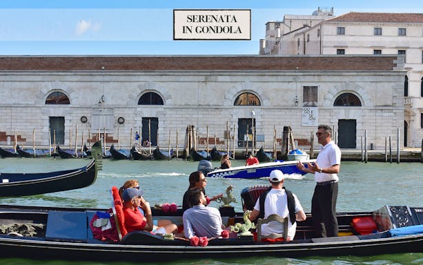 Gondola ride with serenade on Venice canal, Italy.