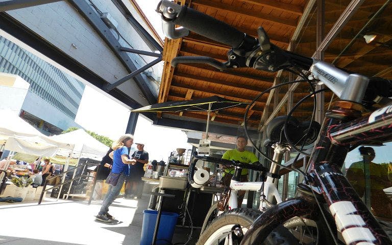Bicycle parked near a Los Angeles outdoor market during LA in a Day Bike Adventure.