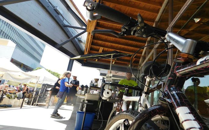 Bicycle parked near a Los Angeles outdoor market during LA in a Day Bike Adventure.
