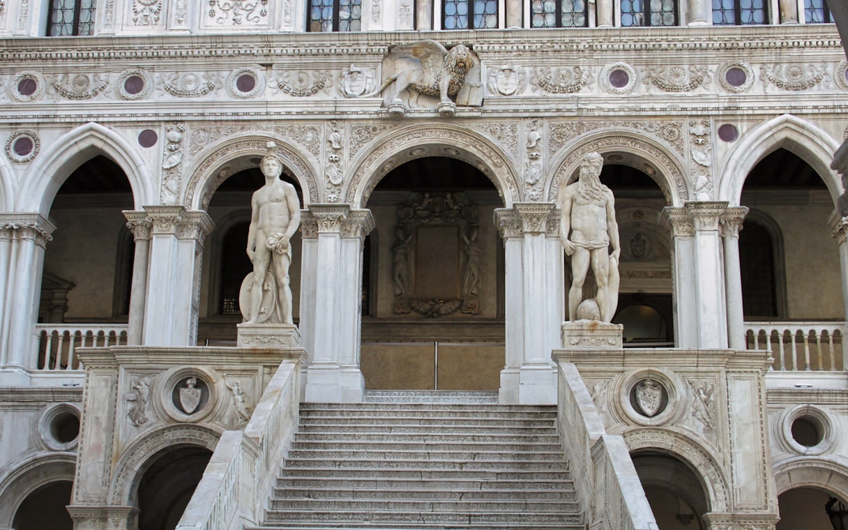 Doge's Palace staircase with statues in Venice, Italy.