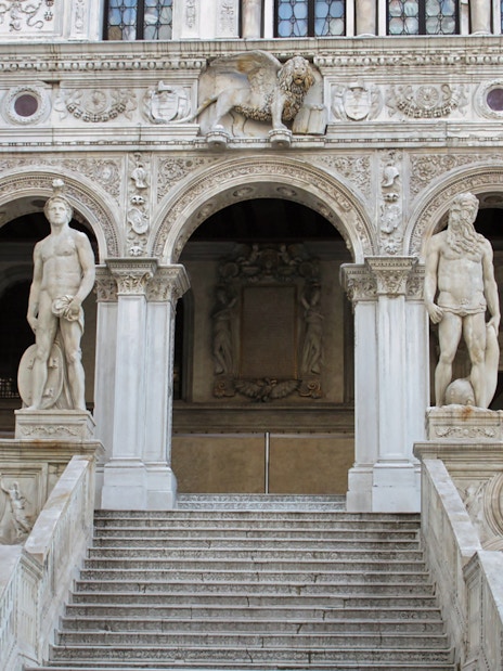 Doge's Palace staircase with statues in Venice, Italy.