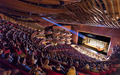 Audience watching a performance at Dubai Opera House.