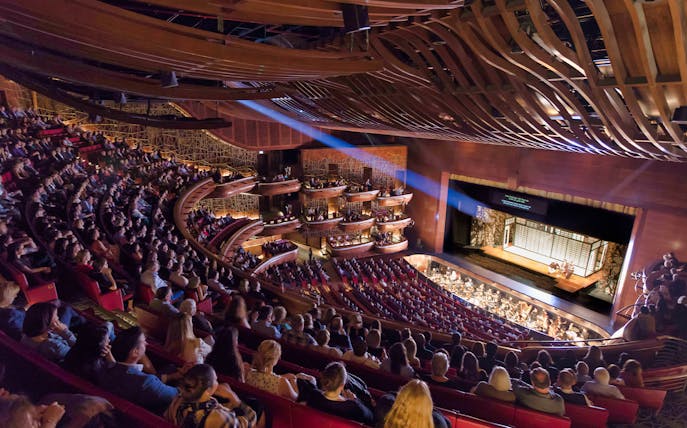 Audience watching a performance at Dubai Opera House.