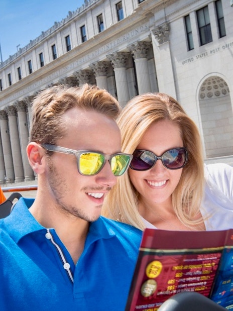 Open-top bus tour in New York City with passengers viewing a map near the U.S. Post Office on Eighth Ave.