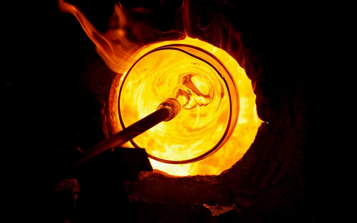 Glassblowing in a furnace on Murano Island during a guided tour.