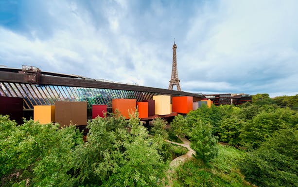 Quai Branly Museum with Eiffel Tower in background, Paris.