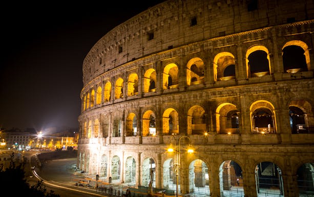 Colosseum illuminated at night, Rome, part of a small group guided tour.