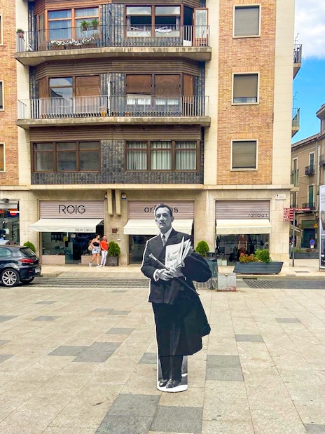 Cutout of Salvador Dalí in a Girona square, part of the Girona & Figueres day trip from Barcelona.