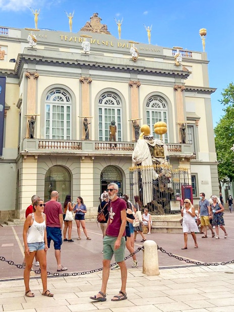 Dalí Theatre-Museum facade with visitors in Figueres, part of Girona & Figueres day trip from Barcelona.