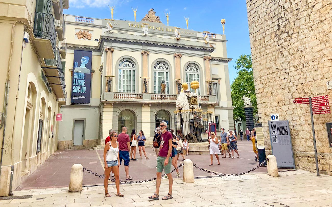 Dalí Theatre-Museum facade with visitors in Figueres, part of Girona & Figueres day trip from Barcelona.