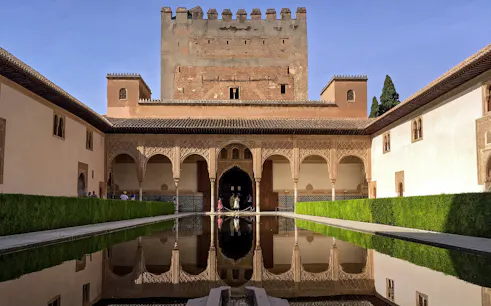 Alhambra Palace courtyard with reflecting pool, Granada, Spain.