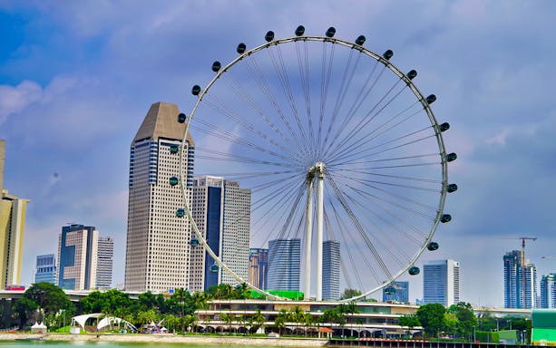 Singapore Flyer with city skyline in the background near Gardens by the Bay.