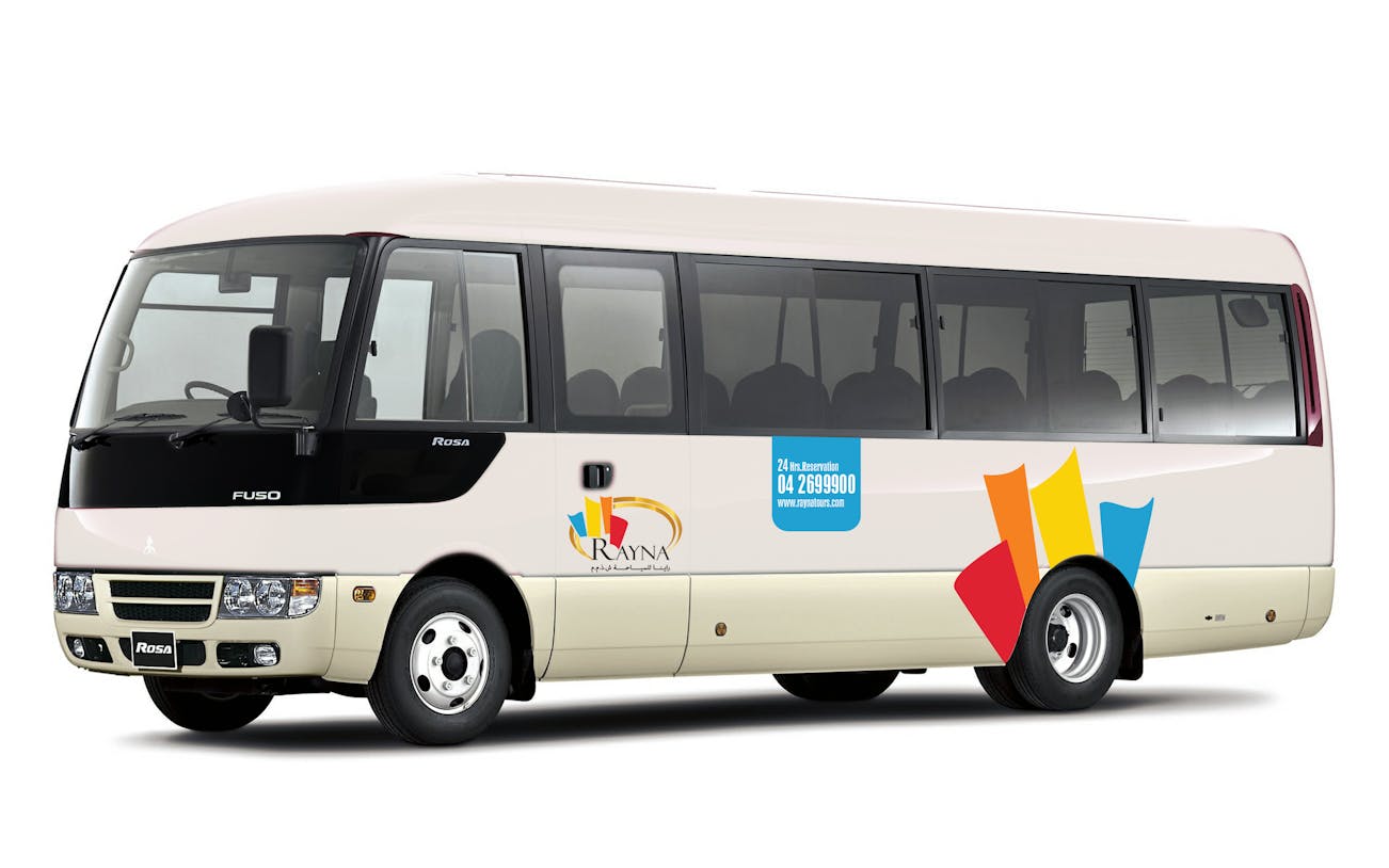 Shuttle bus for airport drop-off to Terminal 1/3 with company logo.