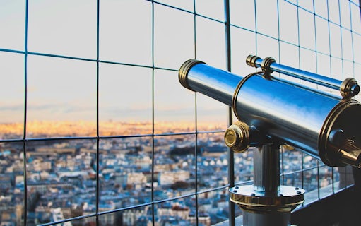 Viewing telescope on Eiffel Tower 2nd floor overlooking Paris.