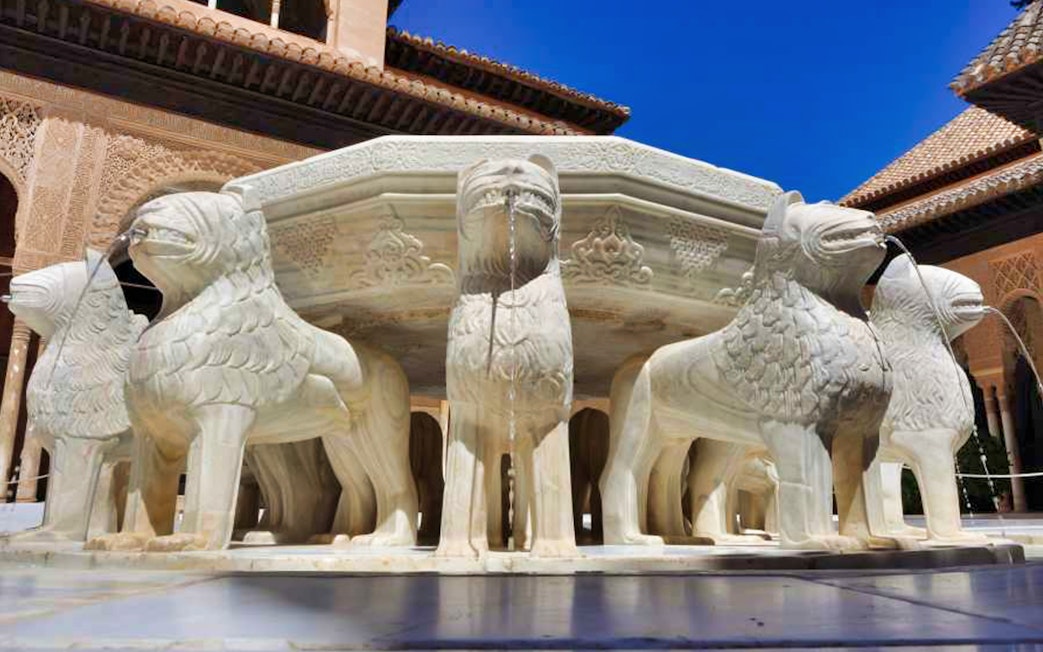 Lion Fountain at Alhambra's Nasrid Palaces, Granada, Spain.
