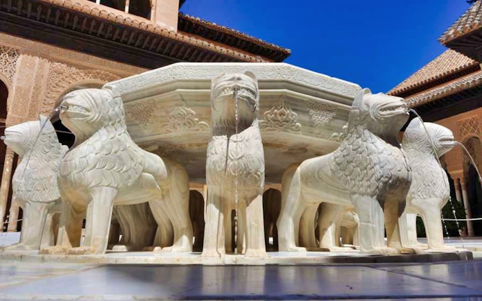 Lion Fountain at Alhambra's Nasrid Palaces, Granada, Spain.