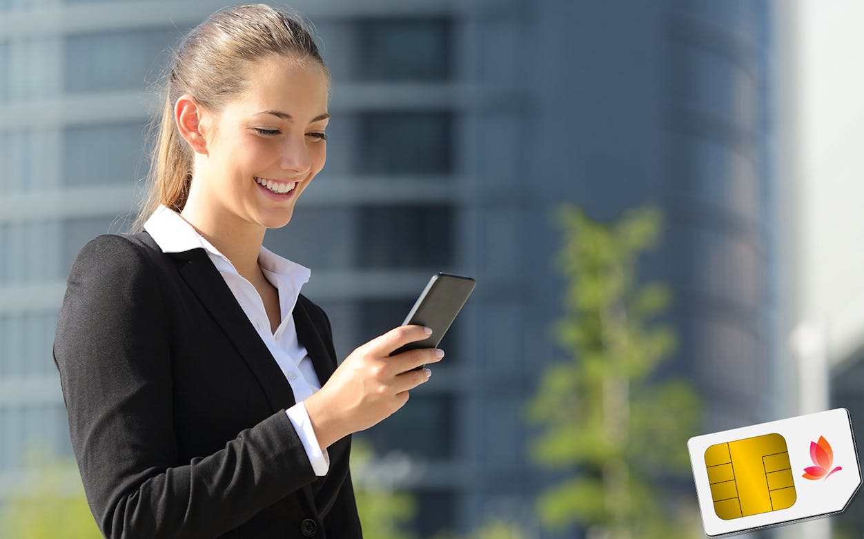 Business traveler using phone with SIM card, representing Private Lexus Airport Transfers.