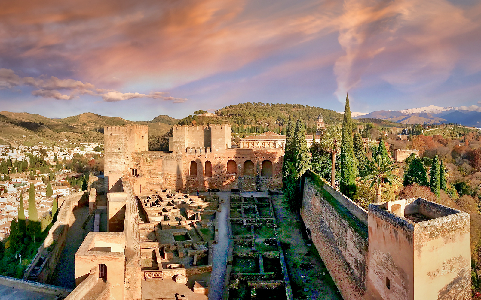 Alhambra's Alcazaba fortress with scenic views of Granada, Spain.