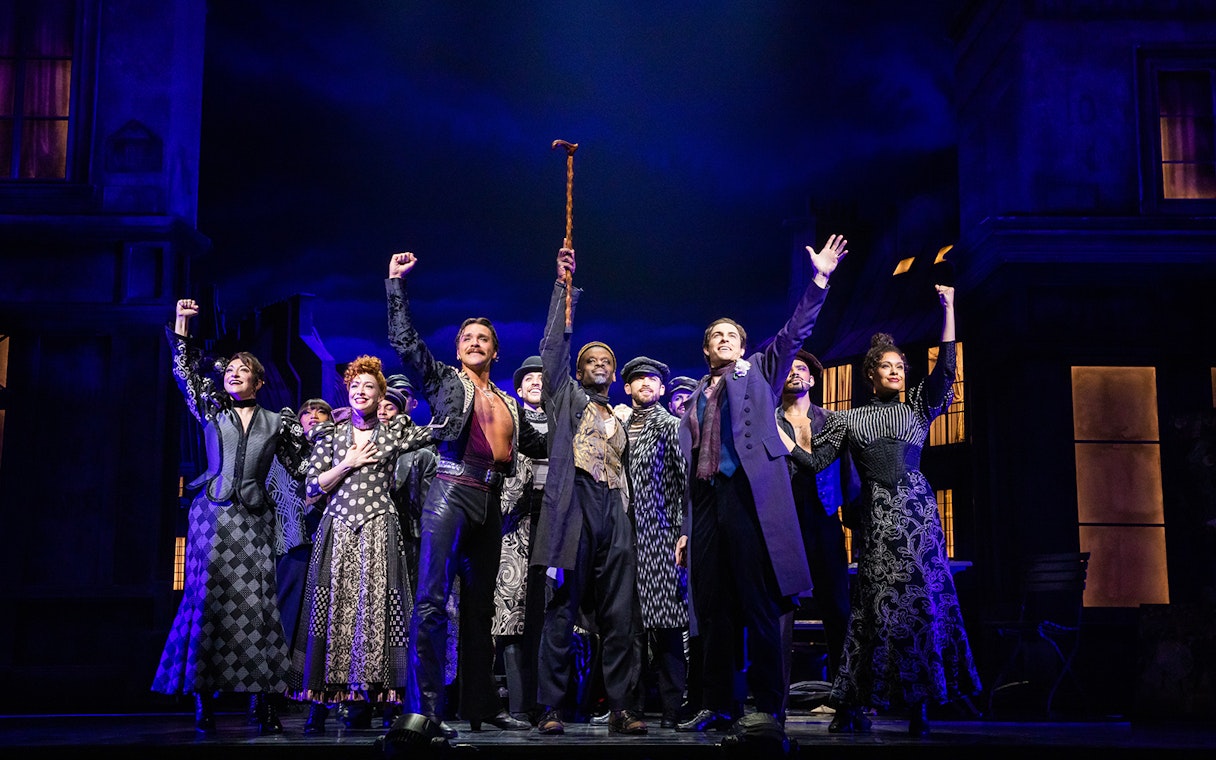 Cast of Moulin Rouge! The Musical taking a bow on stage.