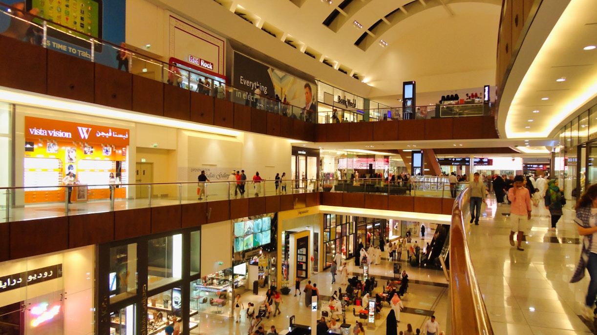 Dubai Mall interior with visitors near cinema ticket counters.