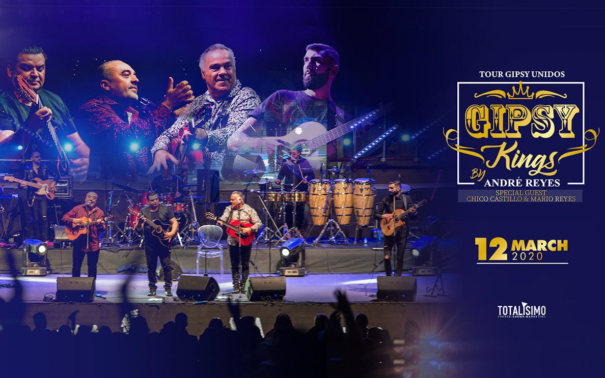 Gipsy Kings by Andre Reyes performing live on stage with band members and instruments.