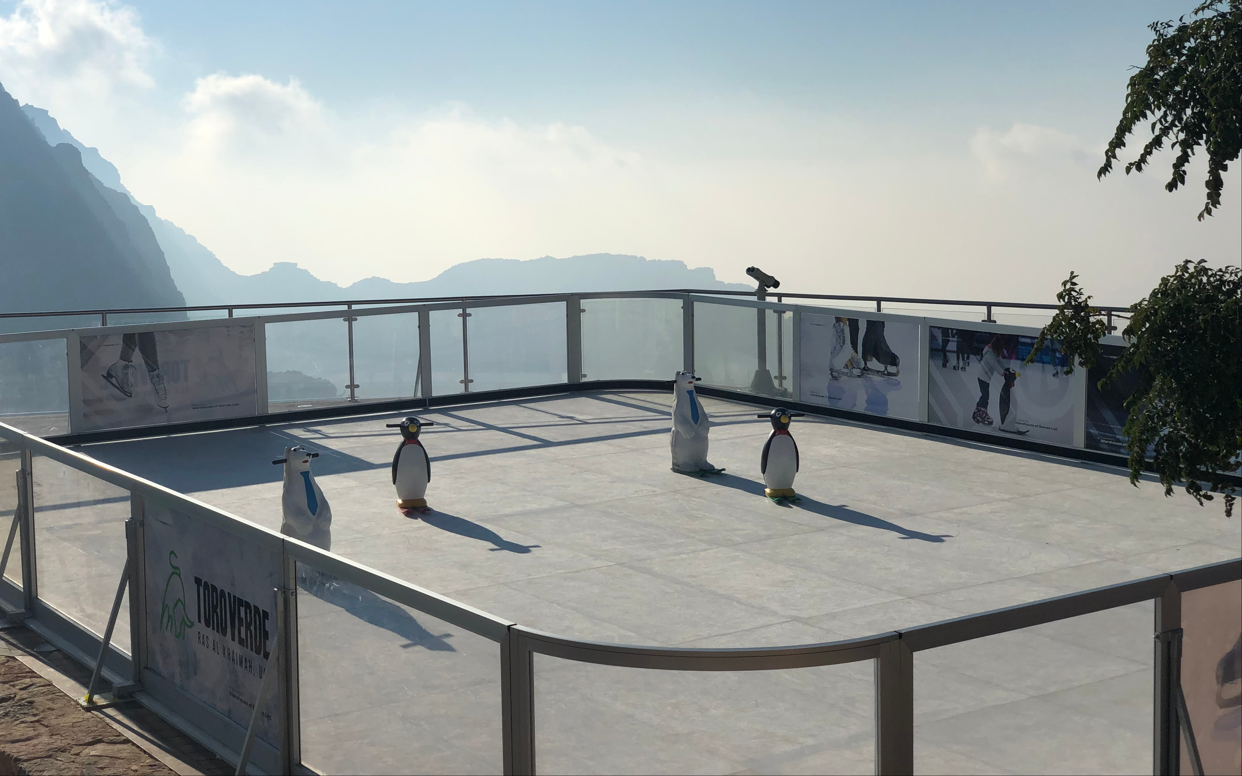 Jebel Jais skating rink with penguin skating aids and mountain view.