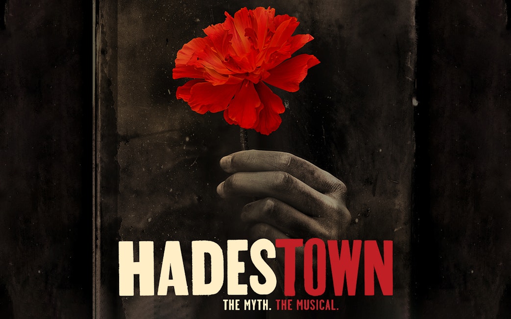 Hand holding a red flower with "Hadestown" text below.