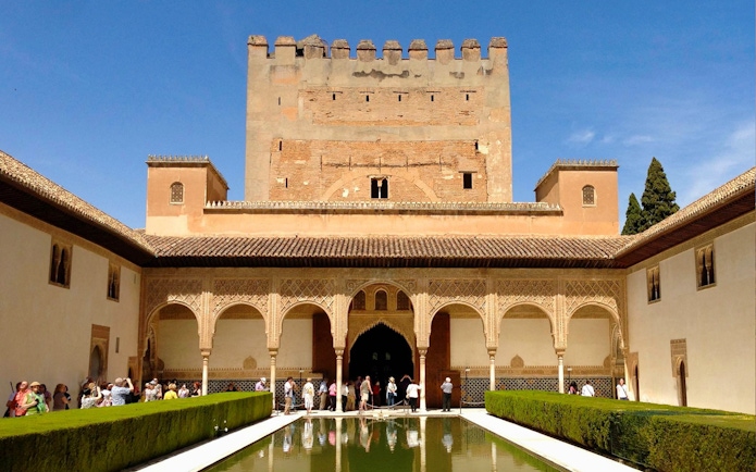 Alhambra courtyard with reflecting pool and Nasrid Palaces, Granada, Spain.