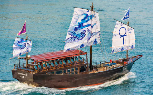 Traditional Chinese junk boat AquaLuna sailing in Stanley Bay, Hong Kong.
